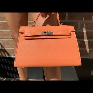 Fashion handbag in orange, mint green and sky blue